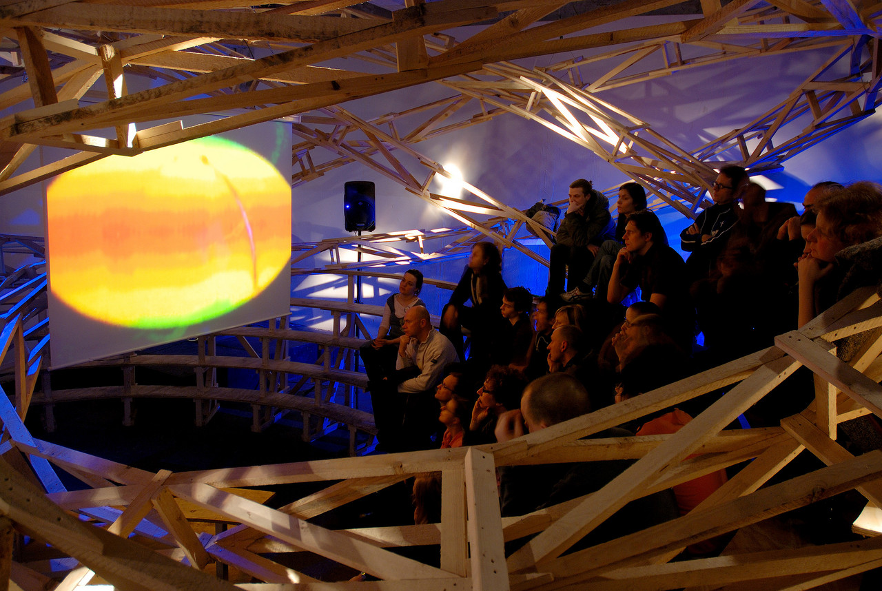 An audience watchs a film within the installation »Bingowing« by Kai Schiementz, CTM 2007, Maria am Ostbahnhof