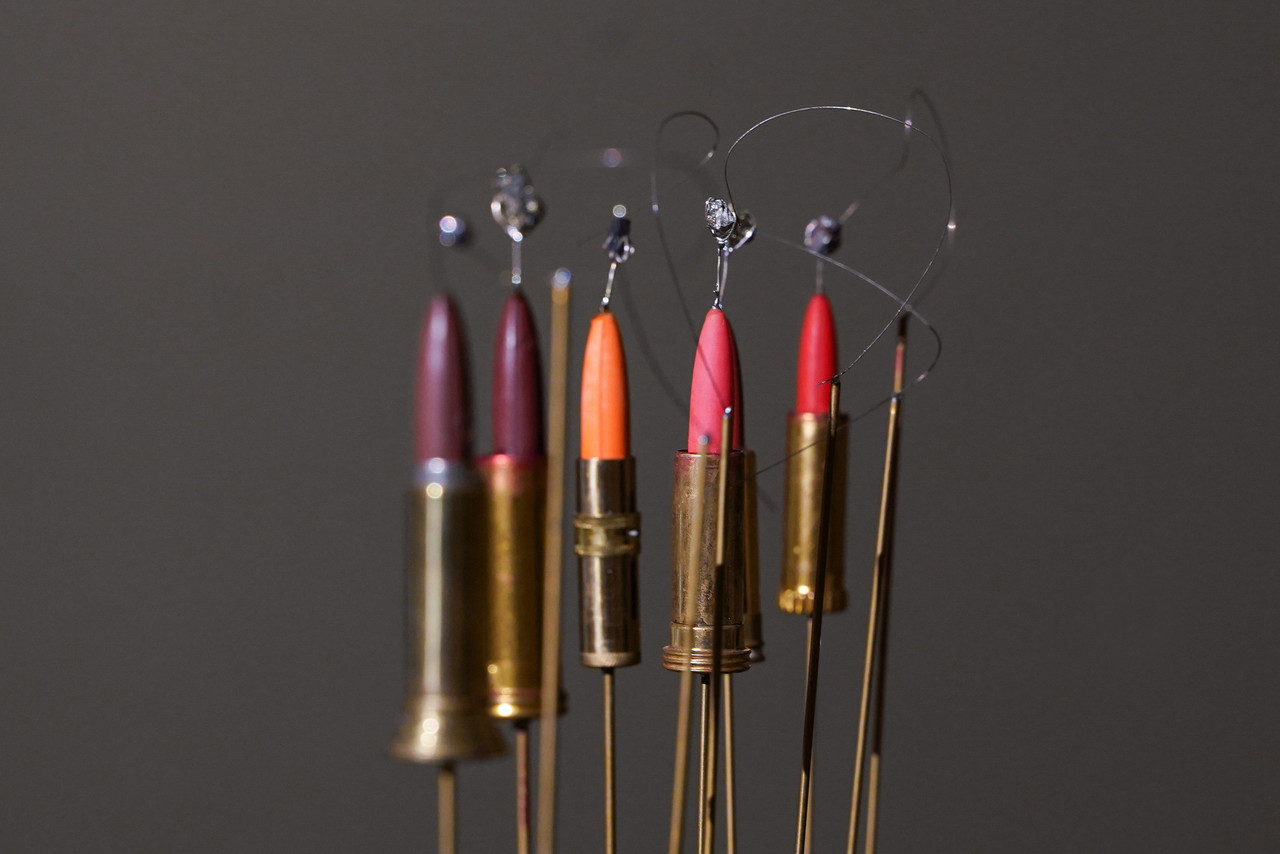 Bullet-shaped lipsticks become FM radio receivers in Ioana Vreme Moser's works